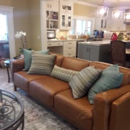 Leather sofa with throw pillows