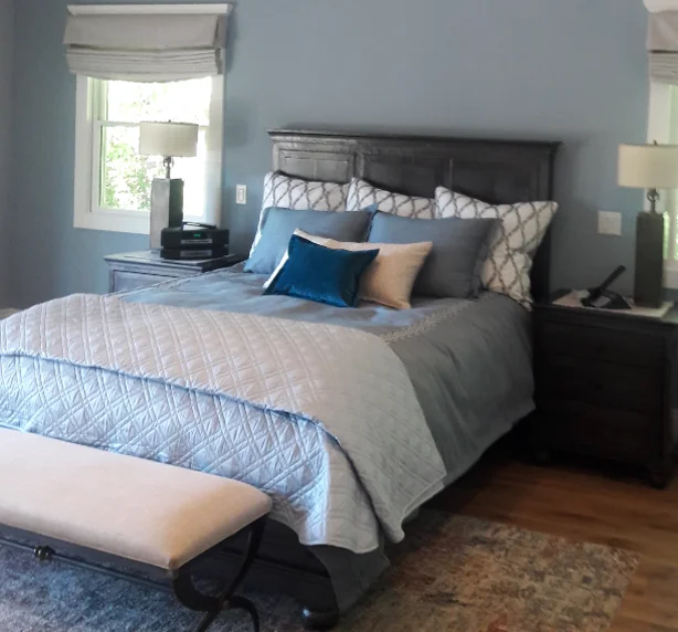 bedroom-with-blue-walls-and-bedding-with-hardwood-floors