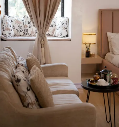 Cozy seating area with custom drapery and soft neutral tones